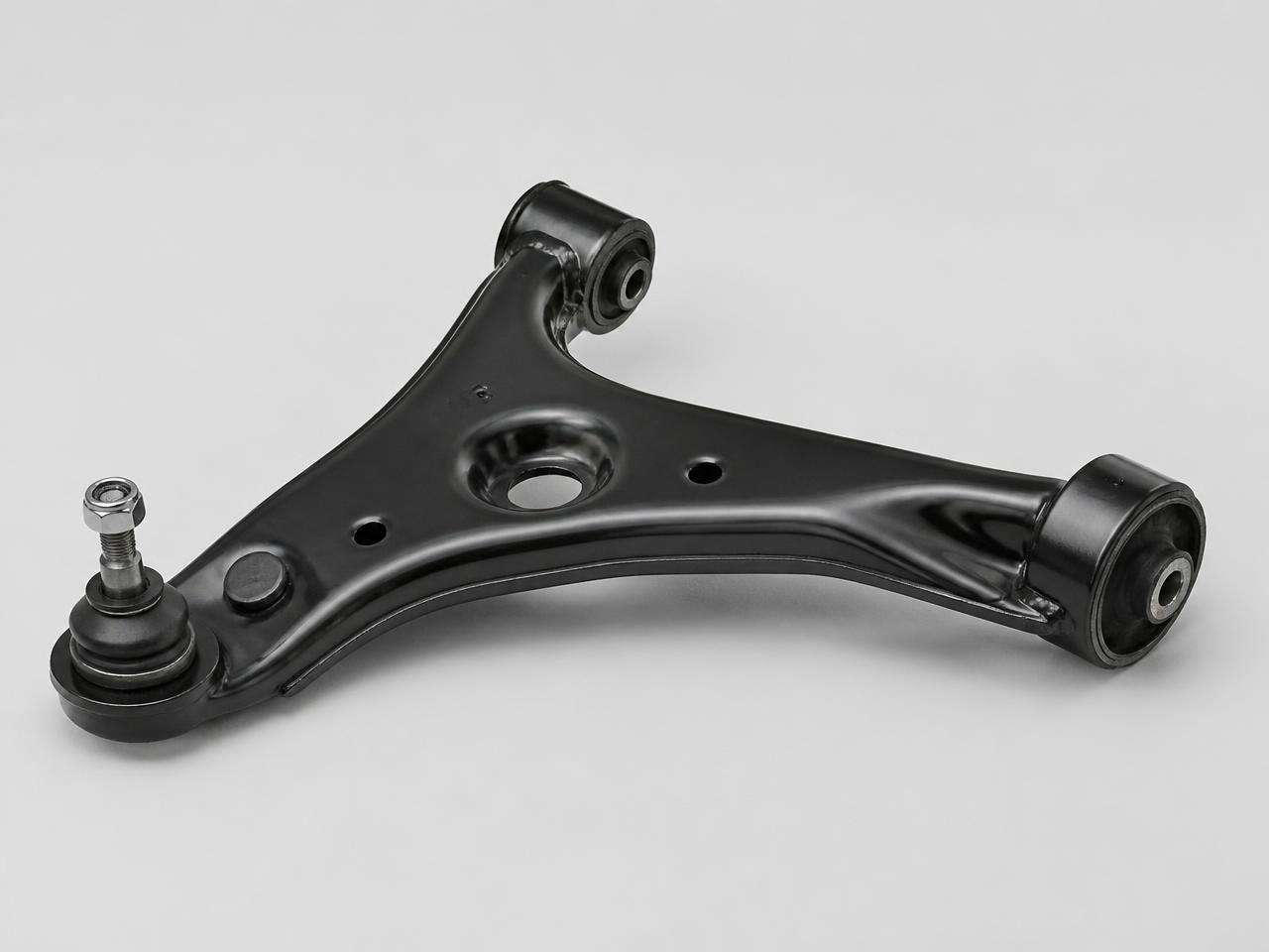 Steel automotive lower control arm with bushings and ball joint