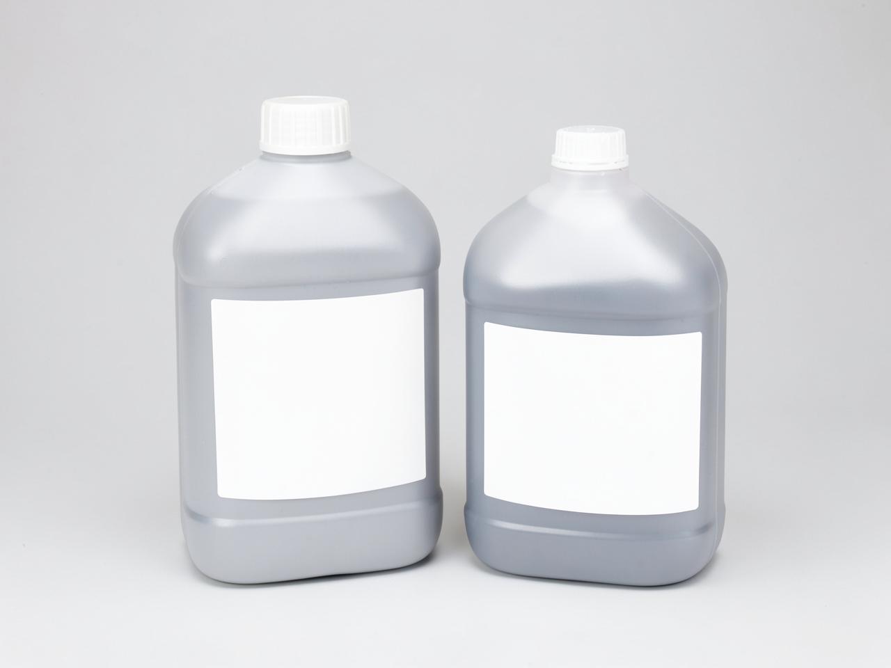 Unbranded coolant and antifreeze bottles with blank labels